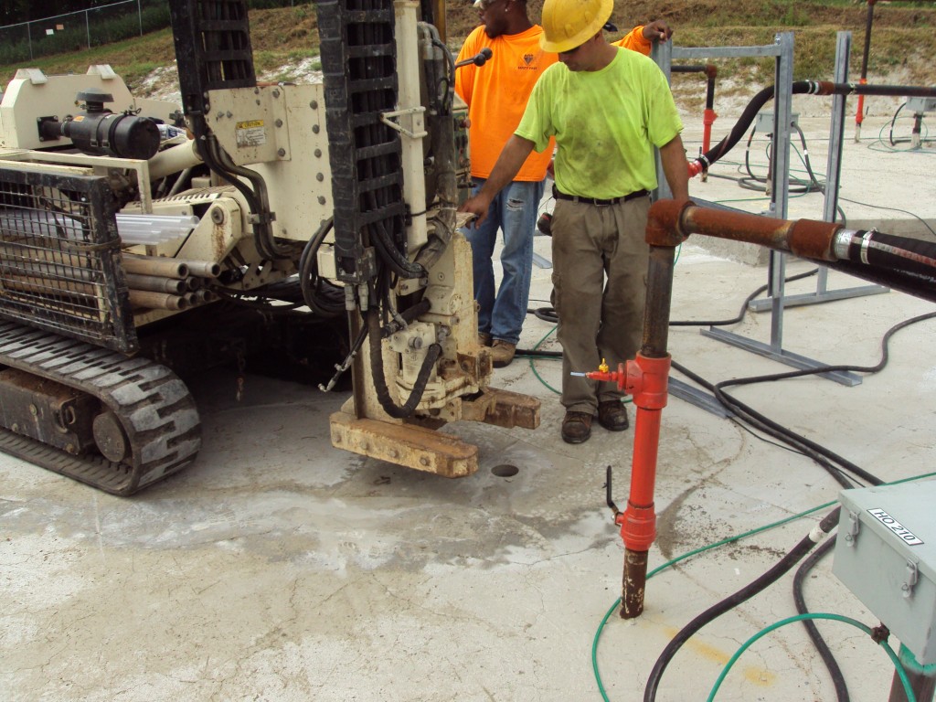 Geoprobe drilling through the concrete cap for sampling.
