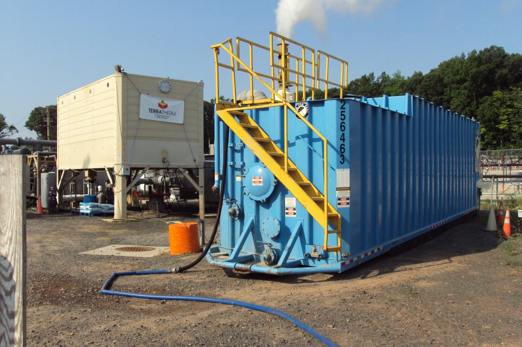 Frac tank (mobile steel storage tank) for extra discharge water.